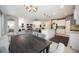 Open-concept kitchen and living area with a large island and modern lighting at 2239 Ellarose Cir, Sarasota, FL 34232