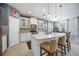 Kitchen island with barstool seating, stainless steel appliances, and an open layout at 2239 Ellarose Cir, Sarasota, FL 34232