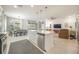 Open-concept kitchen with stainless appliances, center island, and seamless flow to living areas at 2239 Ellarose Cir, Sarasota, FL 34232