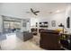 Bright living room with comfortable seating, a ceiling fan, and access to the outdoor patio at 2239 Ellarose Cir, Sarasota, FL 34232