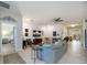 Spacious living room featuring tile flooring, a comfortable sofa, and ample natural light at 2239 Ellarose Cir, Sarasota, FL 34232