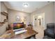 Cozy home office featuring a wood desk, comfortable seating, and bright natural light at 2239 Ellarose Cir, Sarasota, FL 34232