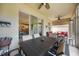 Lovely covered patio ideal for outdoor dining and relaxation, with views into the home's interior at 2239 Ellarose Cir, Sarasota, FL 34232