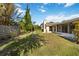 Backyard featuring a well-manicured lawn and mature landscaping at 2271 Pine View Cir, Sarasota, FL 34231