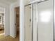 Tiled bathroom features a shower, and closet for storage, offering practical design at 2271 Pine View Cir, Sarasota, FL 34231