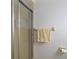 Bathroom features a glass shower door and a towel rack with a yellow towel at 2271 Pine View Cir, Sarasota, FL 34231