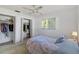 Bedroom featuring closet space and bright natural light through window at 2271 Pine View Cir, Sarasota, FL 34231