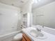 Bathroom featuring a tub-shower, vanity with storage, and bright lighting at 238 Cape Harbour Loop # 104, Bradenton, FL 34212