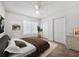 Cozy bedroom with a comfortable bed, a ceiling fan, and natural light, complemented by neutral decor at 238 Cape Harbour Loop # 104, Bradenton, FL 34212