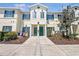 Charming townhome featuring green shutters and landscaping at 238 Cape Harbour Loop # 104, Bradenton, FL 34212