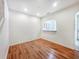 Bright living room featuring hardwood floors, neutral walls, and an open view to the kitchen at 238 Cape Harbour Loop # 104, Bradenton, FL 34212
