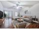 Bright living room featuring modern furnishings, stylish decor, and a sliding glass door for natural light at 238 Cape Harbour Loop # 104, Bradenton, FL 34212