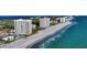 Breathtaking aerial view of beachfront condos along the coast, offering a luxurious coastal lifestyle with beach access at 2525 Gulf Of Mexico Dr # 3F, Longboat Key, FL 34228