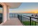 Balcony with stunning ocean views at sunset. A tranquil outdoor space offering captivating beachside scenery at 2525 Gulf Of Mexico Dr # 3F, Longboat Key, FL 34228