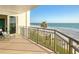 Balcony view featuring ocean and palm trees, a peaceful retreat to enjoy the seaside scenery from a comfortable perch at 2525 Gulf Of Mexico Dr # 3F, Longboat Key, FL 34228