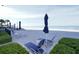 Beach lounging area with multiple chairs and umbrellas, offering a relaxing retreat by the sea with white sand at 2525 Gulf Of Mexico Dr # 3F, Longboat Key, FL 34228