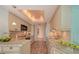Bright kitchen with white countertops and cabinets; pot lights and decorative ceiling detail at 2525 Gulf Of Mexico Dr # 3F, Longboat Key, FL 34228