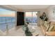 Living room with ocean view, offering a relaxing ambiance enhanced by natural light and contemporary furnishings at 2525 Gulf Of Mexico Dr # 3F, Longboat Key, FL 34228