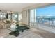 Living room featuring an ocean view, blending indoor comfort with scenic outdoor beauty, a tranquil retreat at 2525 Gulf Of Mexico Dr # 3F, Longboat Key, FL 34228
