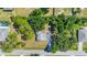 Aerial view of property featuring lush landscaping, offering privacy and serene surroundings at 2538 Lakeshore Cir, Port Charlotte, FL 33952