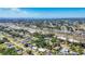 Breath-taking aerial of a sunny neighborhood featuring a mix of homes and easy access to waterfront views at 2538 Lakeshore Cir, Port Charlotte, FL 33952
