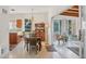 Cozy dining area featuring a wood table, hutch, and natural light at 2538 Lakeshore Cir, Port Charlotte, FL 33952