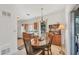 Charming dining area featuring a wood table and hutch with view of kitchen at 2538 Lakeshore Cir, Port Charlotte, FL 33952
