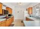 Functional kitchen with retro appliances and ample counter space, offering a nostalgic charm and practicality at 2538 Lakeshore Cir, Port Charlotte, FL 33952