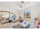 Comfortable living room with lots of natural light, terrazzo floors, and a sliding glass door, perfect for relaxing at 2538 Lakeshore Cir, Port Charlotte, FL 33952