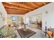 Spacious sunroom with a wood ceiling, tile floor, and sliding glass door at 2538 Lakeshore Cir, Port Charlotte, FL 33952