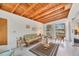 Bright sunroom with a wood ceiling, comfortable seating, and large windows at 2538 Lakeshore Cir, Port Charlotte, FL 33952