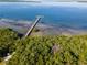 Aerial view of the community pier on the water surrounded by native landscape and mangroves at 2715 Terra Ceia Bay Blvd # 504, Palmetto, FL 34221
