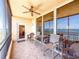 Enjoy the view from this tiled balcony with a ceiling fan, water view and comfortable seating at 2715 Terra Ceia Bay Blvd # 504, Palmetto, FL 34221