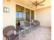 Relax on this tiled balcony with seating, fan, and sliding glass doors offering beautiful water views at 2715 Terra Ceia Bay Blvd # 504, Palmetto, FL 34221