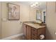 Bathroom with wood cabinets, granite countertops, and stylish decor at 2715 Terra Ceia Bay Blvd # 504, Palmetto, FL 34221