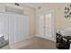 Cozy bedroom with carpeted floors, a large closet, and double doors at 2715 Terra Ceia Bay Blvd # 504, Palmetto, FL 34221