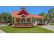 Community entrance building with manicured landscaping and a red tile roof at 2715 Terra Ceia Bay Blvd # 504, Palmetto, FL 34221