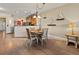 Dining area with a decorative light fixture next to an open kitchen at 2715 Terra Ceia Bay Blvd # 504, Palmetto, FL 34221