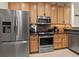 A spacious kitchen with stainless steel appliances and ample wooden cabinet storage at 2715 Terra Ceia Bay Blvd # 504, Palmetto, FL 34221