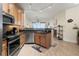 Modern kitchen featuring stainless steel appliances, wooden cabinets, and granite countertops at 2715 Terra Ceia Bay Blvd # 504, Palmetto, FL 34221