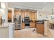 Bright kitchen with stainless steel appliances, granite countertops, and wood cabinets at 2715 Terra Ceia Bay Blvd # 504, Palmetto, FL 34221