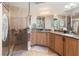 Bathroom with double vanity, granite countertops, and a glass-enclosed shower at 2715 Terra Ceia Bay Blvd # 504, Palmetto, FL 34221