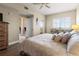 Bright bedroom with a ceiling fan, balcony, and a small table and chairs near the window at 2715 Terra Ceia Bay Blvd # 504, Palmetto, FL 34221