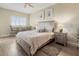 Comfortable bedroom featuring a ceiling fan, light wood furniture, wall art and a small table and chairs at 2715 Terra Ceia Bay Blvd # 504, Palmetto, FL 34221