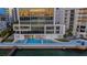 Waterfront condo with a swimming pool and outdoor living spaces at 280 Golden Gate Pt # 600, Sarasota, FL 34236