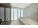 The bathroom features a soaking tub and modern wood accents at 280 Golden Gate Pt # 600, Sarasota, FL 34236