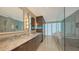 Modern bathroom featuring dual vanities, a large walk-in shower, and a luxurious soaking tub at 280 Golden Gate Pt # 600, Sarasota, FL 34236