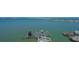 Aerial view of a boat lift on the water, providing easy boat storage and access at 280 Golden Gate Pt # 600, Sarasota, FL 34236