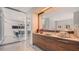 Office kitchenette with stylish cabinetry and modern appliances, open to glass enclosed conference room at 280 Golden Gate Pt # 600, Sarasota, FL 34236