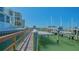 Dock featuring a boat lift along the waterfront at 280 Golden Gate Pt # 600, Sarasota, FL 34236